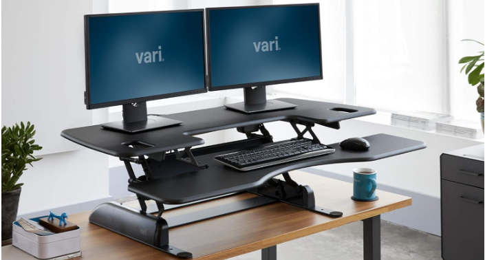 Adjustable height desk with two monitor setup
